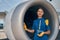 Smiling airline female employee looking at the camera