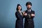 Smiling airplane aviator and stewardess couple in uniform