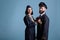 Smiling airplane pilot and flight attendant couple in uniform