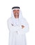 Smiling arabian man standing arms crossed over white background