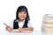 Smiling Asian Chinese little girl wearing school uniform studying
