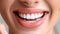 Smiling asian indian model with clean teeth in dental ad closeup portrait on blurred background