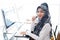 Smiling asian Muslim women is call center or secretary operator is wearing a headset and a microphone for consultant to customers