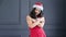 Smiling Asian Santa Claus woman posing at studio with gray background