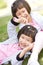 Smiling asian twin girls