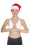 Smiling asian woman in Santa`s hat engaged in fitness