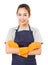 Smiling Asian Woman Standing With Arms Crossed Wearing Apron And Rubber Gloves.