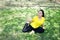Smiling Asian young woman in yellow sportwear sitting and doing yoga for meditation for create concentration and calm the mind on