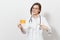 Smiling attractive doctor woman with stethoscope isolated on white background. Female doctor in medical gown showing