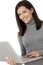 Smiling attractive woman with laptop