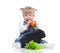 Smiling baby eating a carrot and feeding rabbit