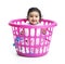 Smiling Baby Girl Sitting in the Laundry Basket