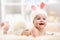 Smiling baby in rabbit costume