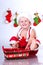 Smiling baby Santa Claus with Christmas basket