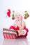 Smiling baby Santa Claus with Christmas garlands