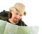 Smiling backpacker in hat looking into his map