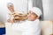 Smiling Baker Receiving Bread Waste From Coworker