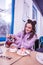 Smiling beaming lady spending great time in cafeteria