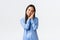 Smiling beautiful asian woman in blue pajamas going to sleep, looking happy and healthy. Cheerful korean girl in jammies