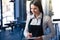 Smiling beautiful female waiter in apron