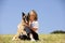 Smiling beautiful woman hugging her dog