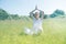 Smiling beautiful young yoga woman praying for toned spiritual mindfulness