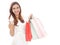 smiling beauty woman holding shopping bags while thumbs up