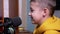 Smiling Blogger Boy Talking into Microphone, Vlogging for Kids in Pro Studio