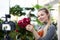 Smiling Blogger Touching Red Hydrangea Photo