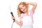 Smiling blond girl twists her hair with a hair curler on a white background
