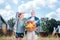 Smiling blonde-haired wife feeling satisfied after gathering harvest with husband