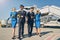 Smiling blonde stewardesses and airmen in sunglasses
