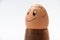 Smiling boiled egg on the wooden egg holder