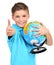 Smiling boy in casual holding globe with thumbs up
