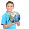 Smiling boy in casual holding planet earth in hands