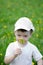 Smiling boy in dandelion meadow