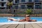 Smiling boy on the edge of swimming pool