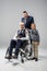smiling boy with grandfather in wheelchair