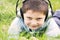 Smiling boy in headphones outdoors