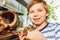 Smiling boy holding Royal python in his hands