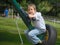 Smiling boy resting on large spin-swing
