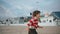 Smiling boy running beach on autumn weekend. Playful child enjoying holiday