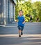 Smiling boy running with ice cream