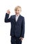 Smiling boy in school uniform shows an OK gesture and makes happy face. Schoolboy fooling around isolated on white background