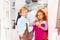 Smiling boy with vest and girl shopping together