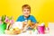 Smiling boys holds plate with Eastern eggs