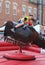 Smiling Boys Ride Mechanical Bull at Mexican Street Festival in Chicago