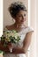 Smiling bride with bouquet