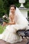 Smiling bride in white dress