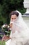 Smiling bride in white with veil